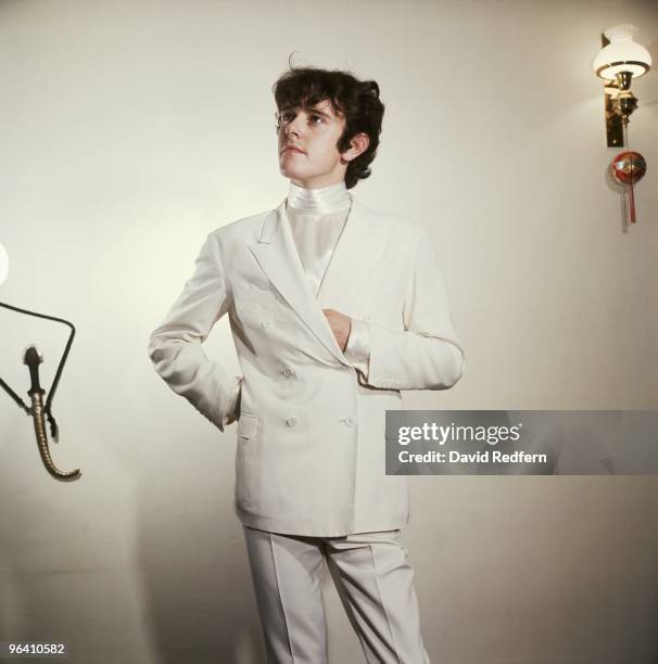 Scottish singer and musician Donovan poses in white double breasted suit and satin shirt for a portrait session circa 1967. Image is part of David...