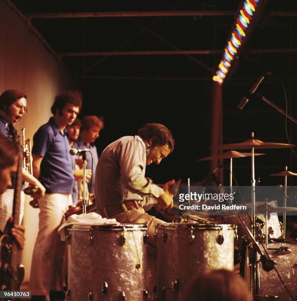American jazz drummer Buddy Rich performs live on stage at his drum kit during a concert at the Wollman Theatre in Central Park, New York in 1975....