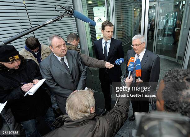 Press officer Harald Stenger, team manager Oliver Bierhoff and president Theo Zwanziger of the German football association talk to the media after...