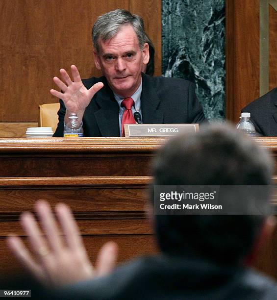 Sen. Judd Gregg questions Treasury Secretary Timothy Geithner during a Senate Budget Committee hearing on February 4, 2010 in Washington, DC. The...