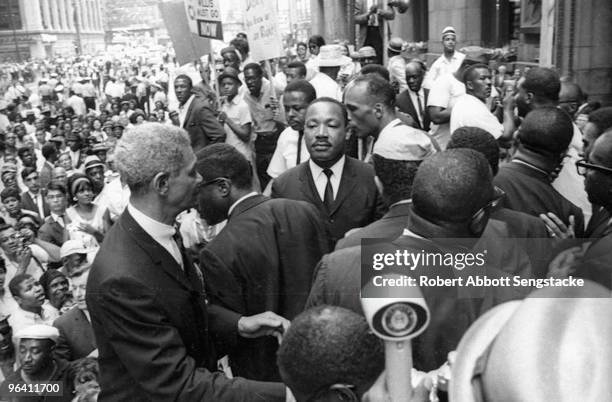 American clergyman and civil rights leader Dr. Martin Luther King Jr. In front of City Hall with hundreds of supporters and members of the Chicago...