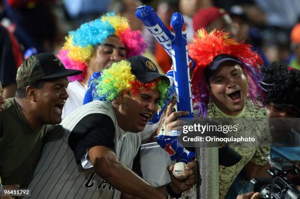 Backers of Venezuela'sv Leones del Caracas, jokes with player before the game against Puerto Rico's Indios Mayaguez as part of the Caribbean Baseball...