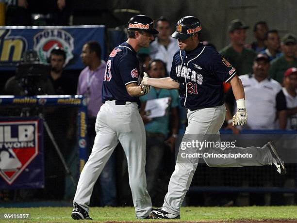 Venezuela's Leones del Caracas player Raul Padron celebrates a home run during a baseball game against Puerto Rico team, Los Indios de Mayaguez....