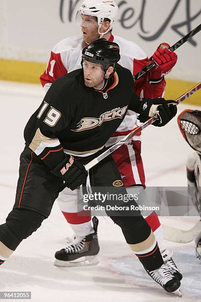 Ryan Whitney of the Anaheim Ducks defends outside the crease against Daniel Cleary of the Detroit Red Wings during the game on February 3, 2010 at...