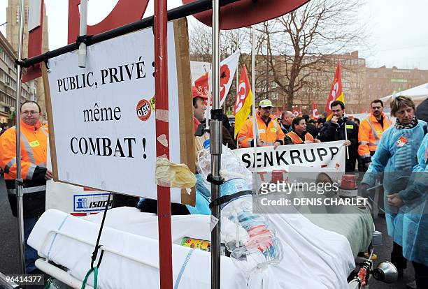 Workers of French oil giant Total refinery protest on February 4, 2010 in Dunkirk, northern France, to decide whether to continue blocking the site...