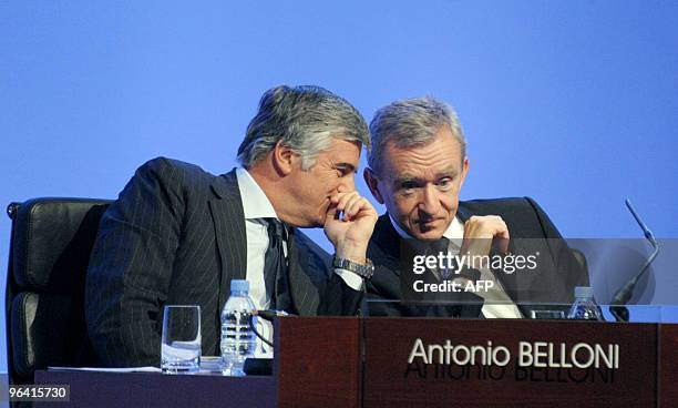 French luxury giant LVMH Chief Executive Bernard Arnault speaks with delegate general director Antonio Belloni during a press conference to present...