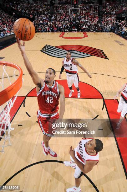 Charlie Bell of the Milwaukee Bucks lays up a shot against Andre Miller of the Portland Trail Blazers during the game on January 13, 2010 at the Rose...