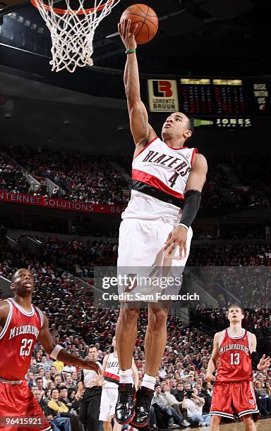 Jerryd Bayless of the Portland Trail Blazers lays up a shot against Jodie Meeks of the Milwaukee Bucks during the game on January 13, 2010 at the...