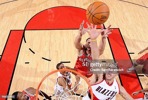 Jeff Pendergraph of the Portland Trail Blazers goes up for the rebound against Dan Gadzuric of the Milwaukee Bucks during the game on January 13,...