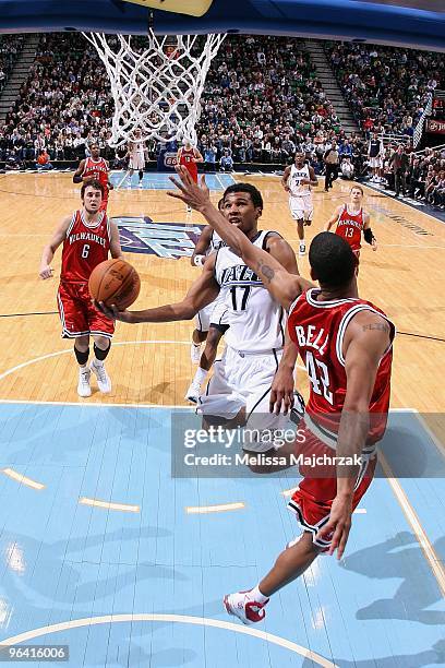 Ronnie Price of the Utah Jazz takes the ball to the basket against Charlie Bell of the Milwaukee Bucks during the game at EnergySolutions Arena on...