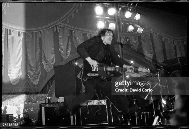 Wilko Johnson of the English R and B group Dr Feelgood performs onstage at the Hammersmith Palais in December 1976 in London, England.