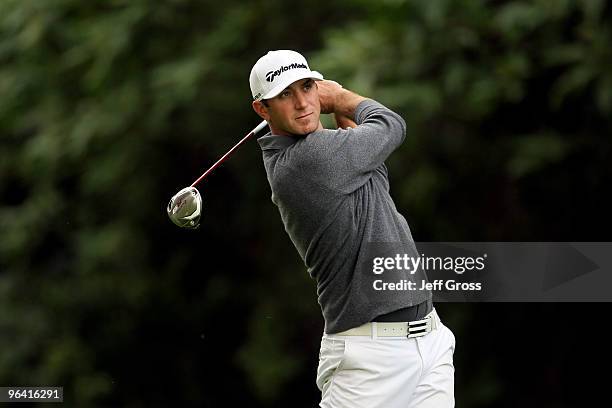 Dustin Johnson hits a tee shot on the 12th hole during the first round of the Northern Trust Open at Riviera Country Club on February 4, 2010 in...