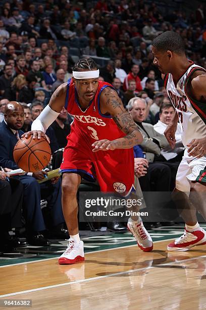 Allen Iverson of the Philadelphia 76ers handles the ball against Charlie Bell of the Milwaukee Bucks during the game on January 27, 2010 at the...