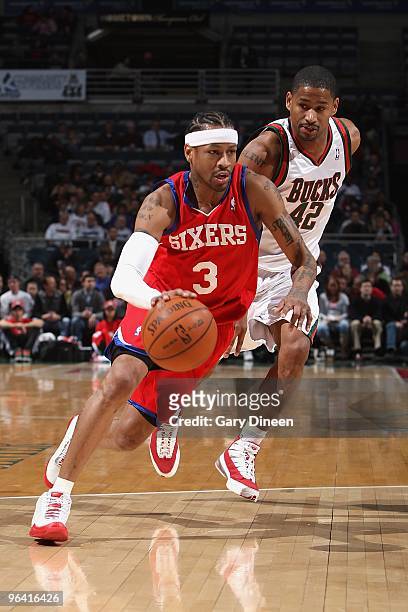 Allen Iverson of the Philadelphia 76ers drives past Charlie Bell of the Milwaukee Bucks during the game on January 27, 2010 at the Bradley Center in...