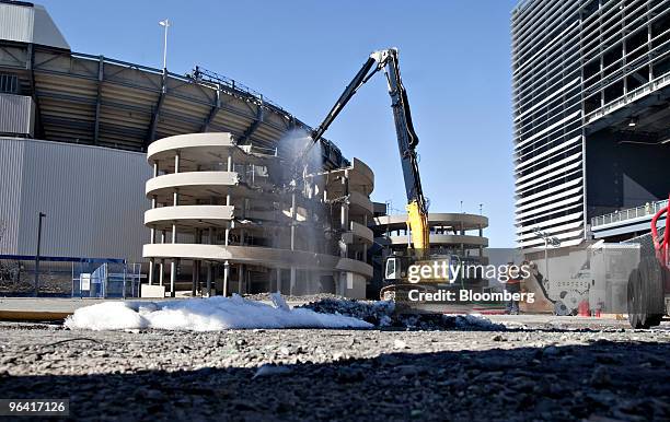 Crane begins demolition of an exterior concrete walkway at the old Giants Stadium in East Rutherford, New Jersey, U.S., on Thursday, Feb. 4, 2010....