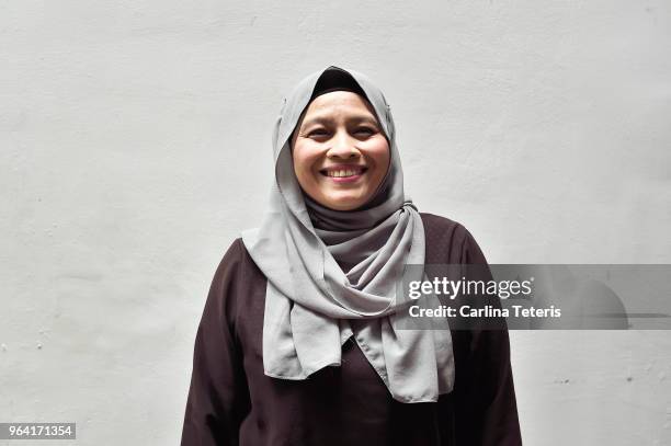 portrait of a middle aged malay woman - malay culture stock-fotos und bilder