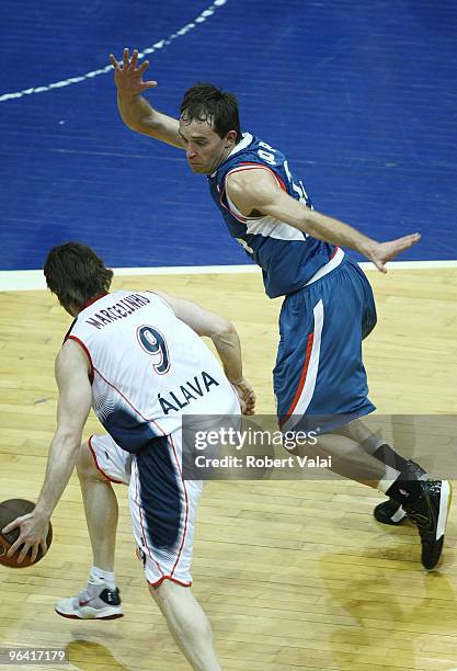 Marcelinho Huertas, #9 of Caja Laboral competes with Udrih Samo, #22 of Cibona in action during the Euroleague Basketball 2009-2010 Last 16 Game 2...