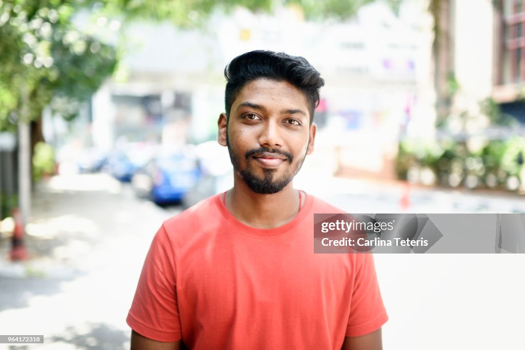 Portrait of a young Malaysian Indian man on the street