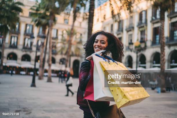 mixed race woman in europe enjoying a shopping - madrid shopping stock pictures, royalty-free photos & images