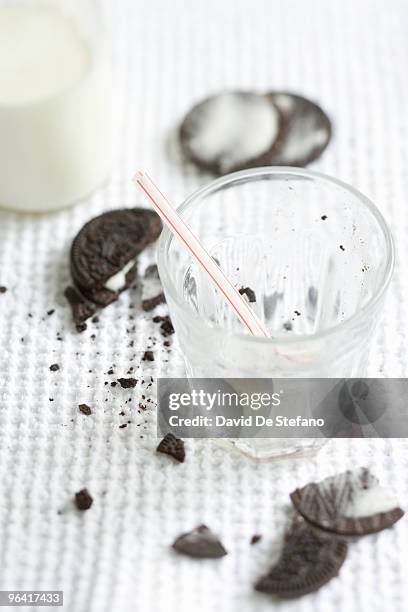 cookies and empty glass of milk. - smula bildbanksfoton och bilder