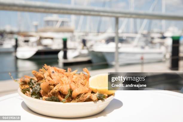 prawns beside the waters edge - mooloolaba stock pictures, royalty-free photos & images