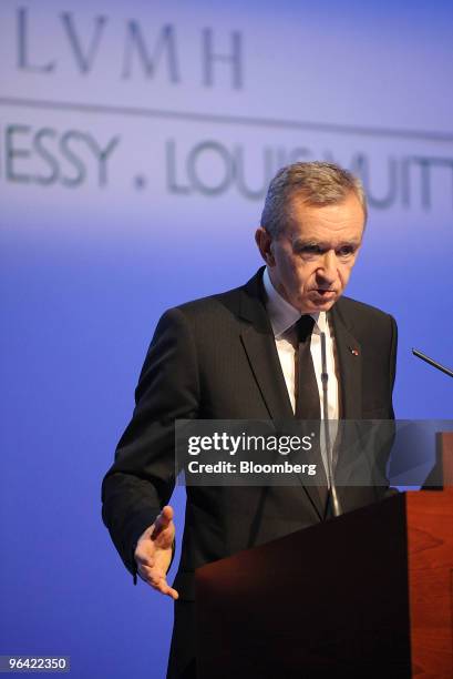 Bernard Arnault, chairman and chief executive officer of LVMH Moet Hennessy Louis Vuitton SA, right,speaks at a news conference at the Espace Louis...