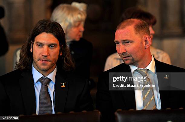 Torsten Frings of Werder Bremen and former player Dieter Eilts look on during the celebration of the 111th year of SV Werder Bremen at the town hall...