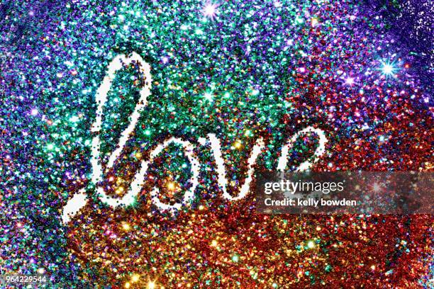 rainbow glitter love word text - kelly bowden stockfoto's en -beelden