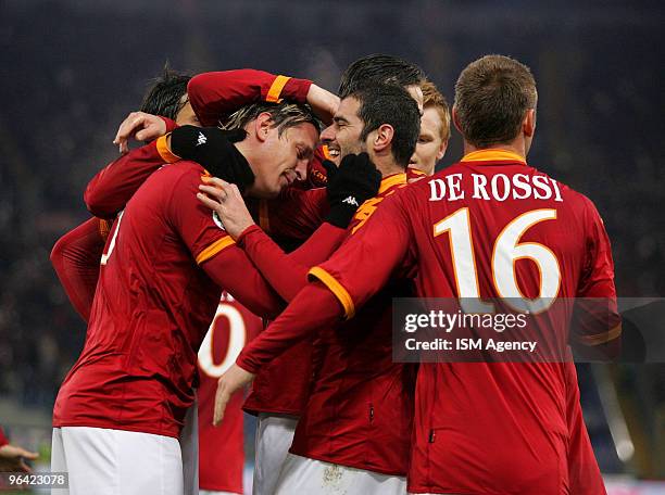 Philippe Mexes of AS Roma celebrates with Simone Perrotta and their team mates after scoring their second goal during the Tim Cup match between AS...