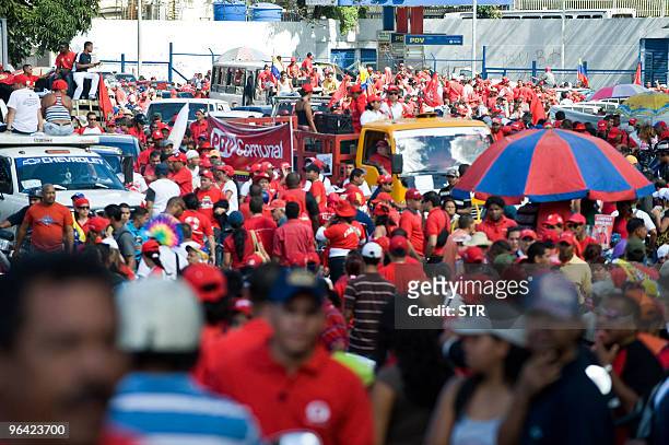 Supporters of Venezuelan President Hugo Chavez, participate of a march to celebrate the 18th anniversary of the failed coup d'etat leaded by Chavez...