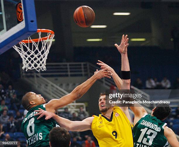 Mike Batiste, #8 of Panathinaikos Athens competes with Jared Homan, #9 of Maroussi BC during the Euroleague Basketball 2009-2010 Last 16 Game 2...