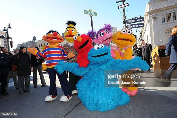 Sesame Street characters Ernie, Bert, Elmo, Cookie Monster, Abby Cadabby and Zoe attend the temporary street renaming to celebrate the 30th...