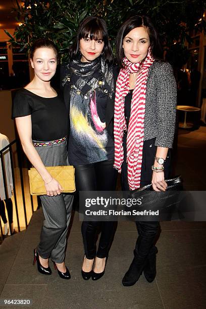 Actress Hannah Herzsprung, actress Susan Hoecke and actress Nadine Warmuth attend the 'Christian Louboutin' cocktail reception at The Corner Shop on...