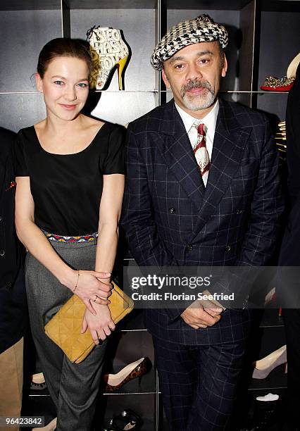 Actress Hannah Herzsprung and shoe Designer Christian Louboutin attend the 'Christian Louboutin' cocktail reception at The Corner Shop on February 4,...