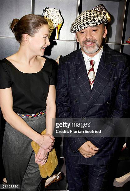 Actress Hannah Herzsprung and shoe Designer Christian Louboutin attend the 'Christian Louboutin' cocktail reception at The Corner Shop on February 4,...