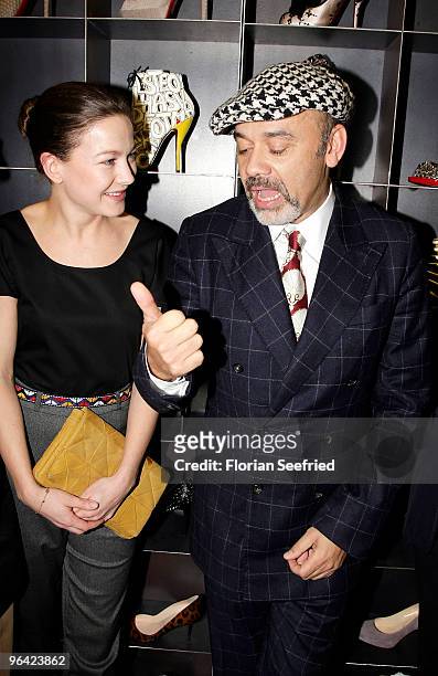 Actress Hannah Herzsprung and shoe Designer Christian Louboutin attend the 'Christian Louboutin' cocktail reception at The Corner Shop on February 4,...