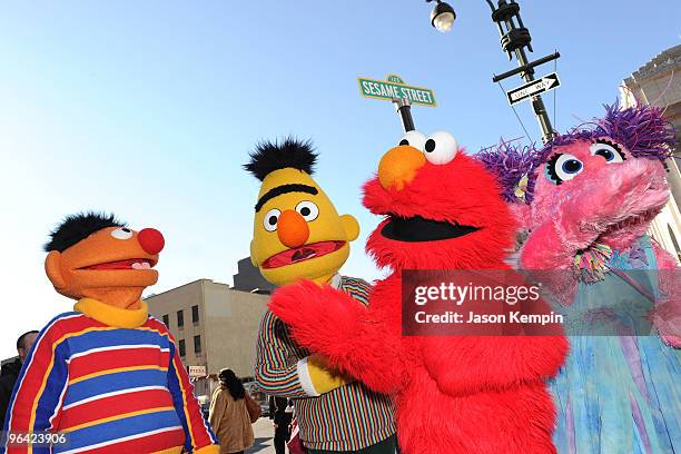 Sesame Street characters Ernie, Bert, Elmo and Abby Cadabby attend the temporary street renaming to celebrate the 30th anniversary of Sesame Street...