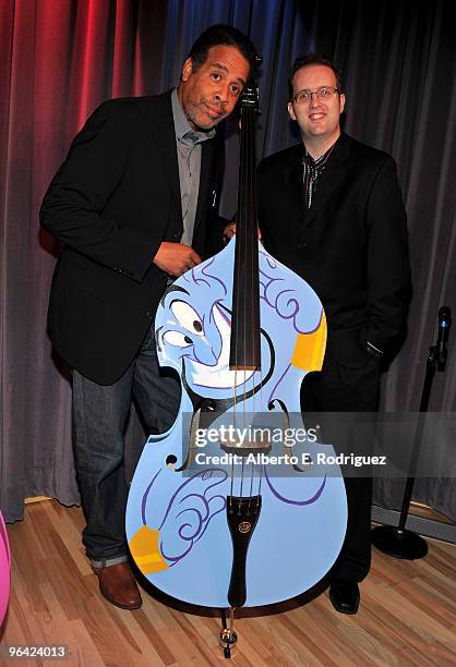 Musician Stanley Clarke and animator Brian Kesinger attend Disney's and The Grammy Foundation's unveiling of 5 unique hand painted upright basses...