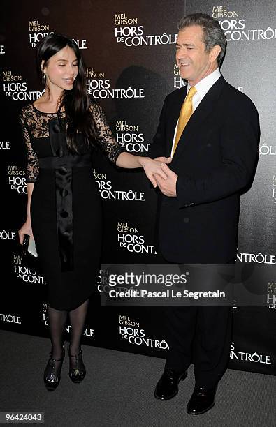 Oksana Grigorieva and U.S actor Mel Gibson pose as they attend the film premiere of "Edge Of Darkness" at Cinema UGC Normandie on February 4, 2010 in...