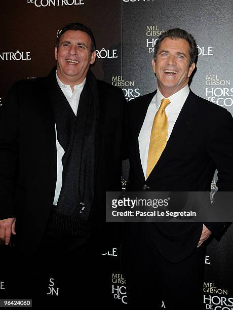 Producer Graham King and U.S actor Mel Gibson pose as they attend the film premiere of "Edge Of Darkness" at Cinema UGC Normandie on February 4, 2010...