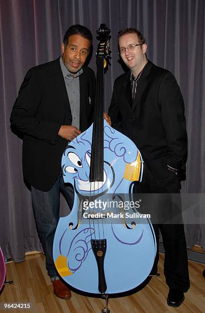Musician/composer Stanley Clarke and artist Douglas Rogers attend the unveiling of hand-painted charity instruments at The GRAMMY Museum on February...