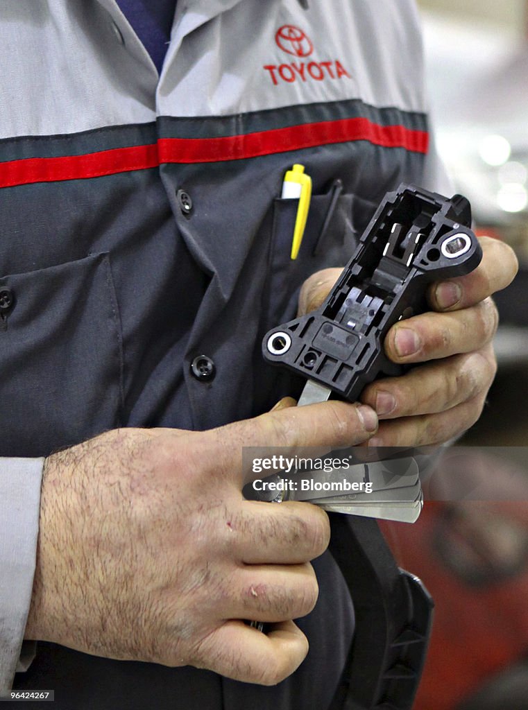 Service technician Frank Russo uses a feeler gauge to determ