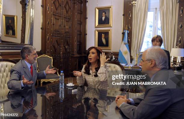 Brazil's Foreign Minister Celso Amorim talks with Argentina's President Cristina Fernandez de Kirchner and Argentine Foreign Minister Jorge Taiana,...