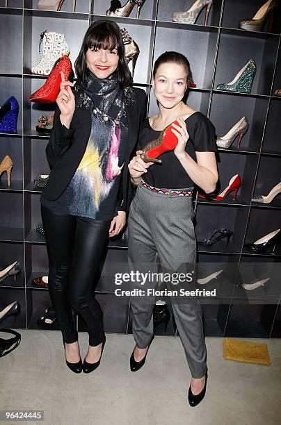 Actors Susan Hoecke and Hannah Herzsprung attend the 'Christian Louboutin' cocktail reception at The Corner Shop on February 4, 2010 in Berlin,...