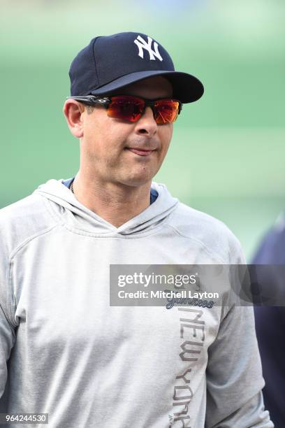 Manager Aaron Boone of the New York Yankees looks on during batting practice of a baseball game against the Washington Nationals at Nationals Park on...