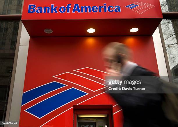 Pedestrian walks past an ATM near the Bank of America headquarters on February 4, 2010 in Charlotte, North Carolina. Bank of America's former Chief...