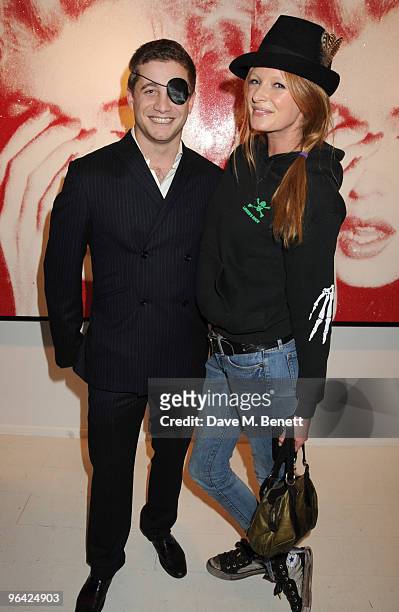 Tyrone Wood and Olivia Inge attend the private view of 'Russell Young: Dirty Pretty Things', at the Scream Gallery on February 4, 2010 in London,...