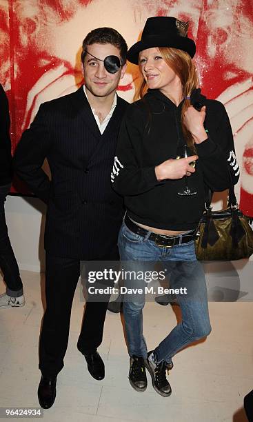 Tyrone Wood and Olivia Inge attend the private view of 'Russell Young: Dirty Pretty Things', at the Scream Gallery on February 4, 2010 in London,...