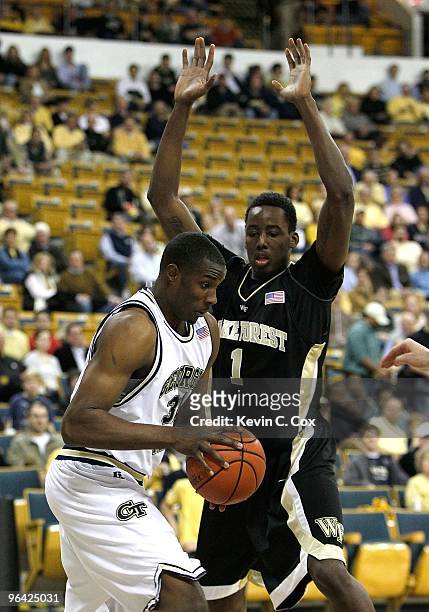 Gani Lawal of the Georgia Tech Yellow Jackets against Al-Farouq Aminu of the Wake Forest Demon Deacons at Alexander Memorial Coliseum on January 28,...