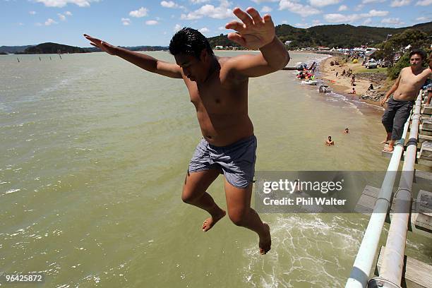 Local children jumps off the bridge leading to the Treaty Grounds on February 5, 2010 in Waitangi, New Zealand. Waitangi Day is the national day of...